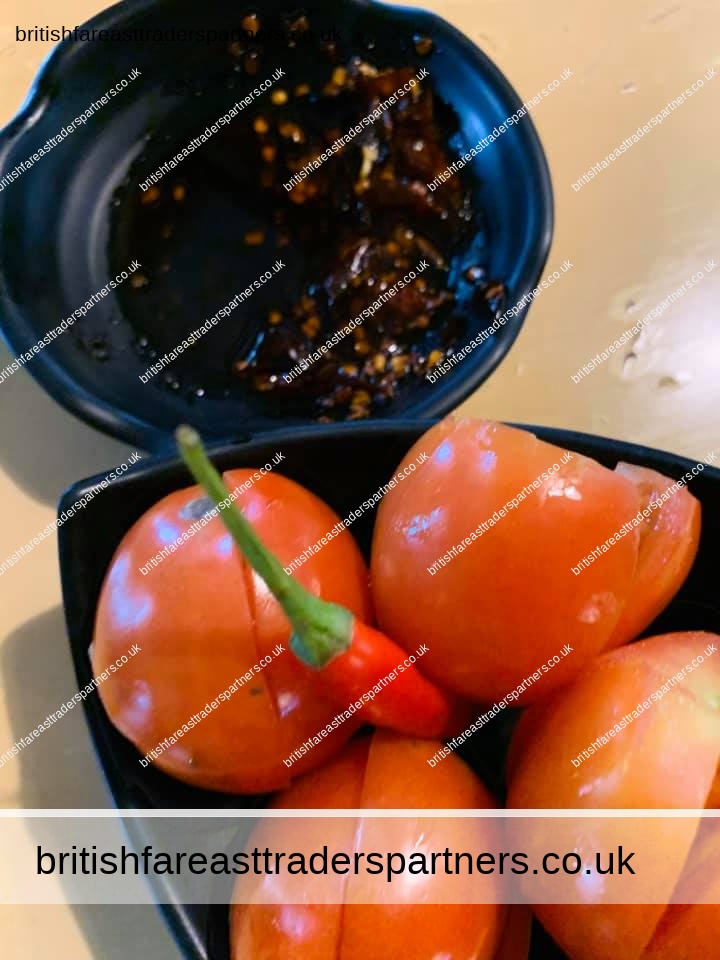 sliced tomatoes and chilli soy sauce in kamayan sa kainyugan, bayombong, nueva vizcaya